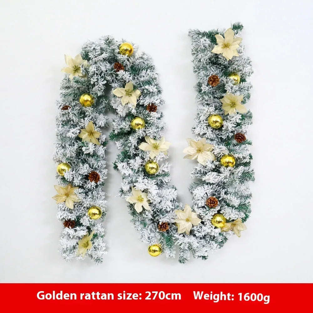 Flocked PVC rattan vine Christmas garland decoration in a festive colour, draped over a mantelpiece.