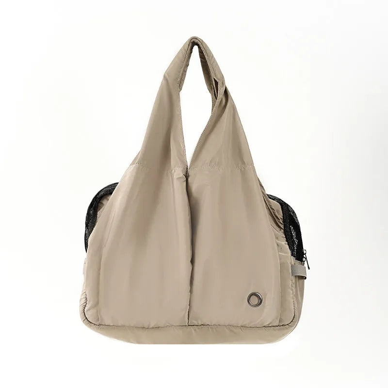 Apricot coloured cloth pet handbag with breathable mesh, shown with dimensions 41cm by 16cm by 28cm