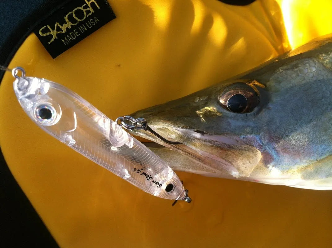 Transparent 9.5cm long blank soft plastic fishing bait body on a white background.