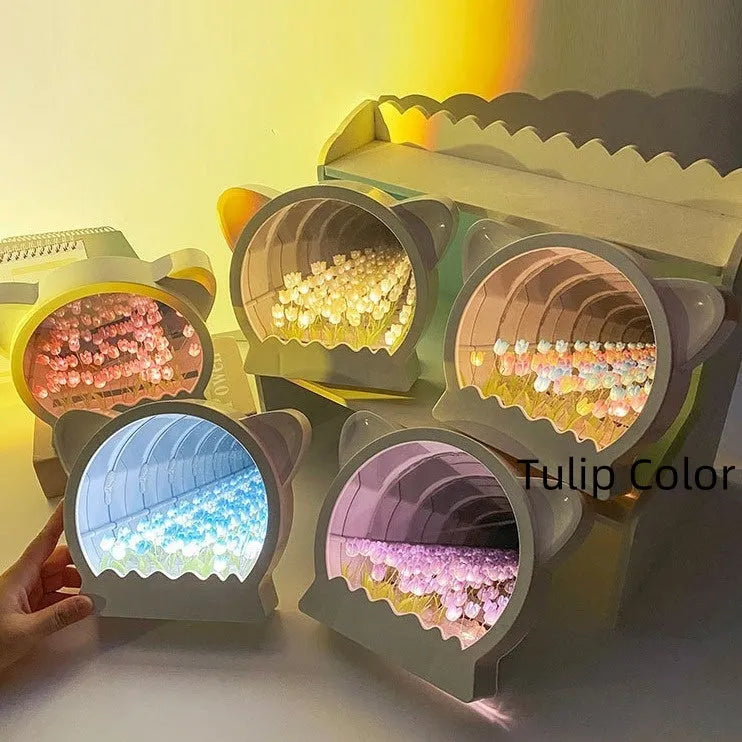 Handmade DIY cat head silhouette night lamp surrounded by tulip flowers, shown in pink colour option.