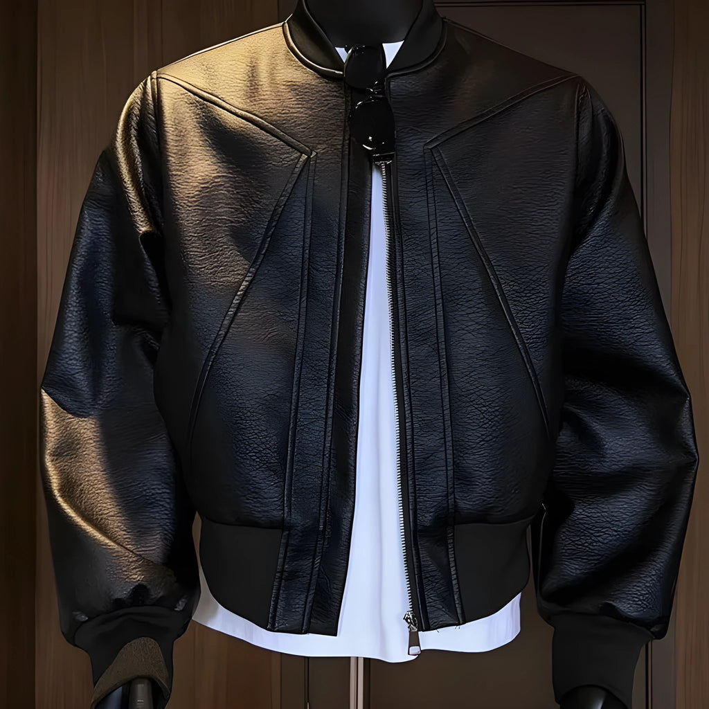 Men's black PU leather jacket with litchi grain texture, showing extended length and tight fit.
