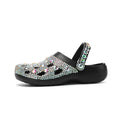 Black women's platform sandals with rhinestone detail on EVA upper.