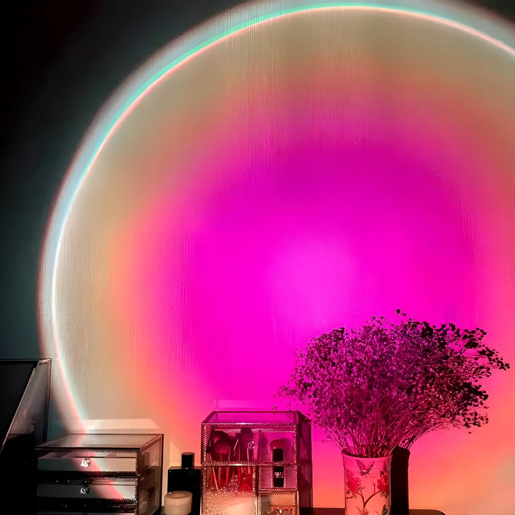 Rechargeable sunset projection lamp showing rainbow colour effects with USB cable