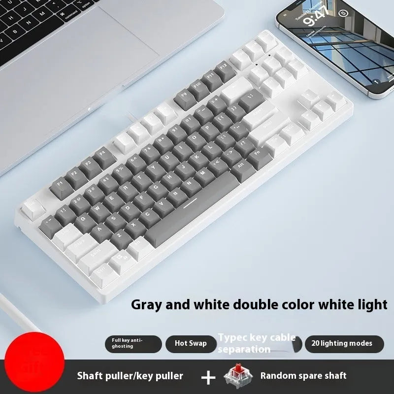 87 key wired mechanical keyboard with metal chassis shown in a black, orange, and yellow colour configuration.