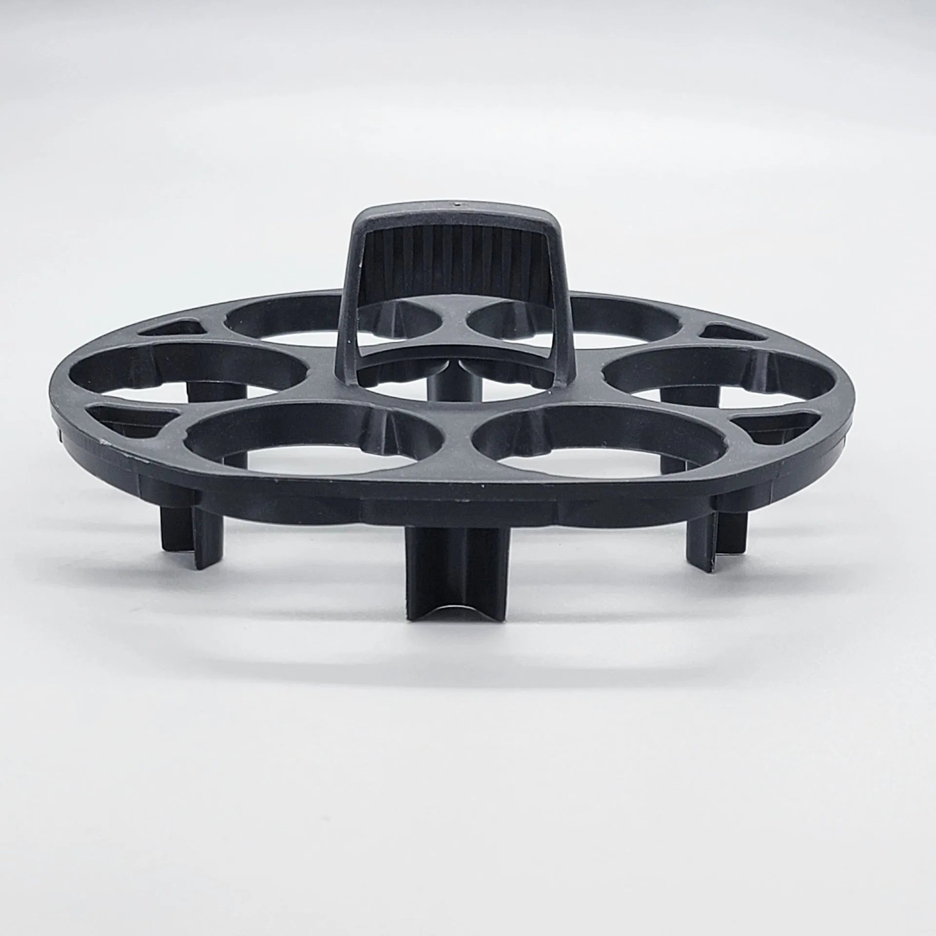 Black plastic egg holder basket measuring 13.8 by 12.6 by 5.7 centimetres