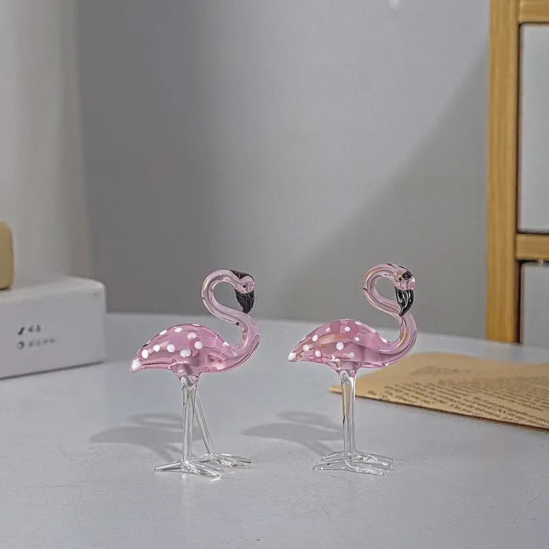 Pink flamingo crystal animal decoration on a tabletop in separate and juxtaposition styles.