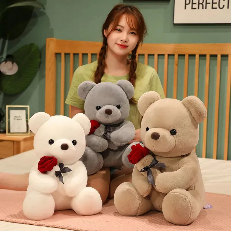 Rose bear plush toy in beige, brown, or grey, shown in sizes from 23cm to 45cm.