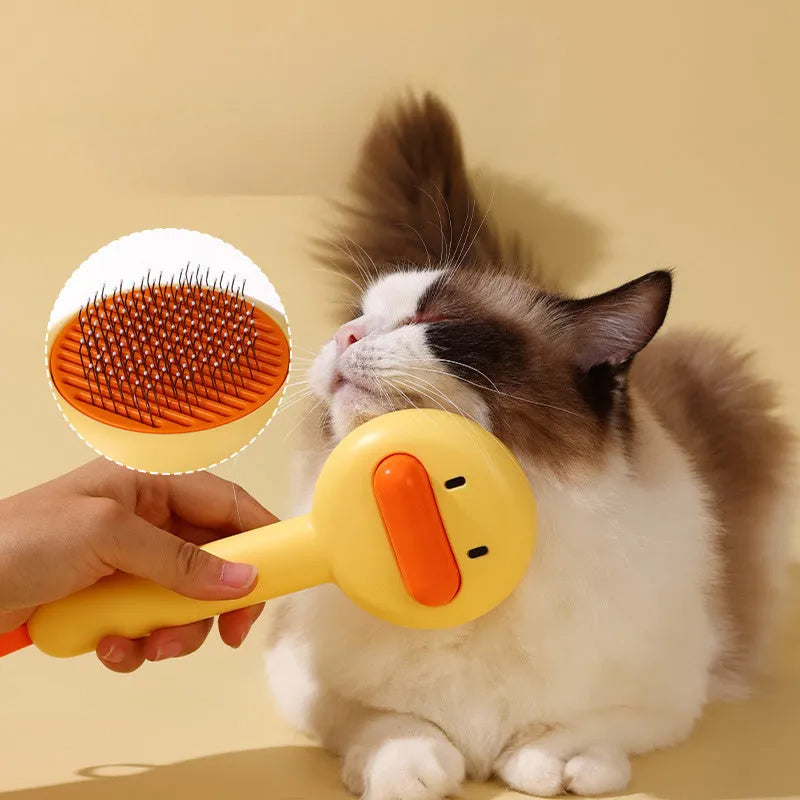 Small yellow cat grooming comb with needle teeth and floating hair removal device