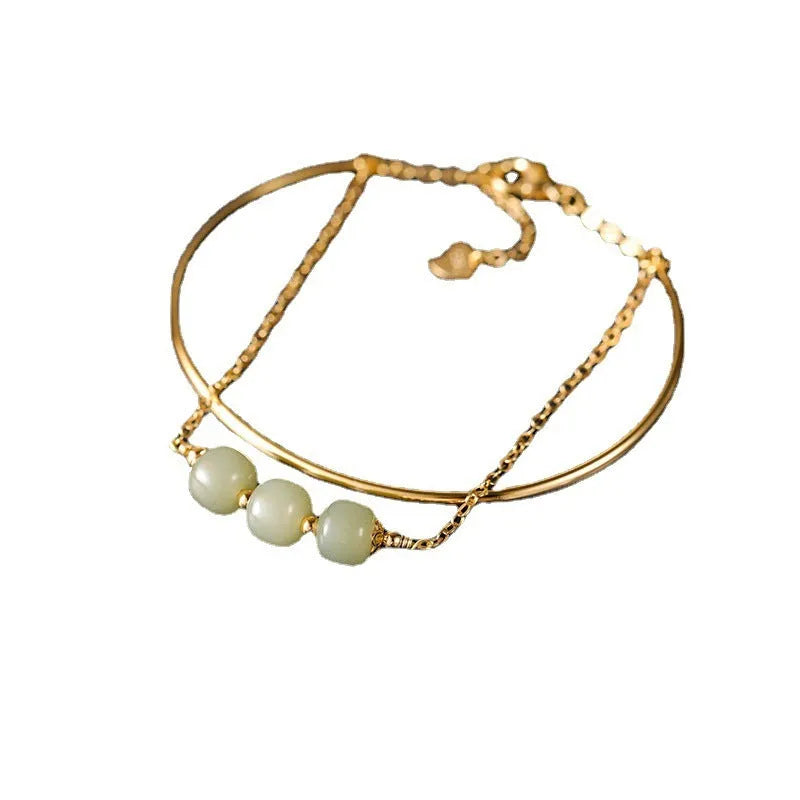 Hetian jade lucky beads bracelet for women with gold inlay, shown in single, double and three bead versions.