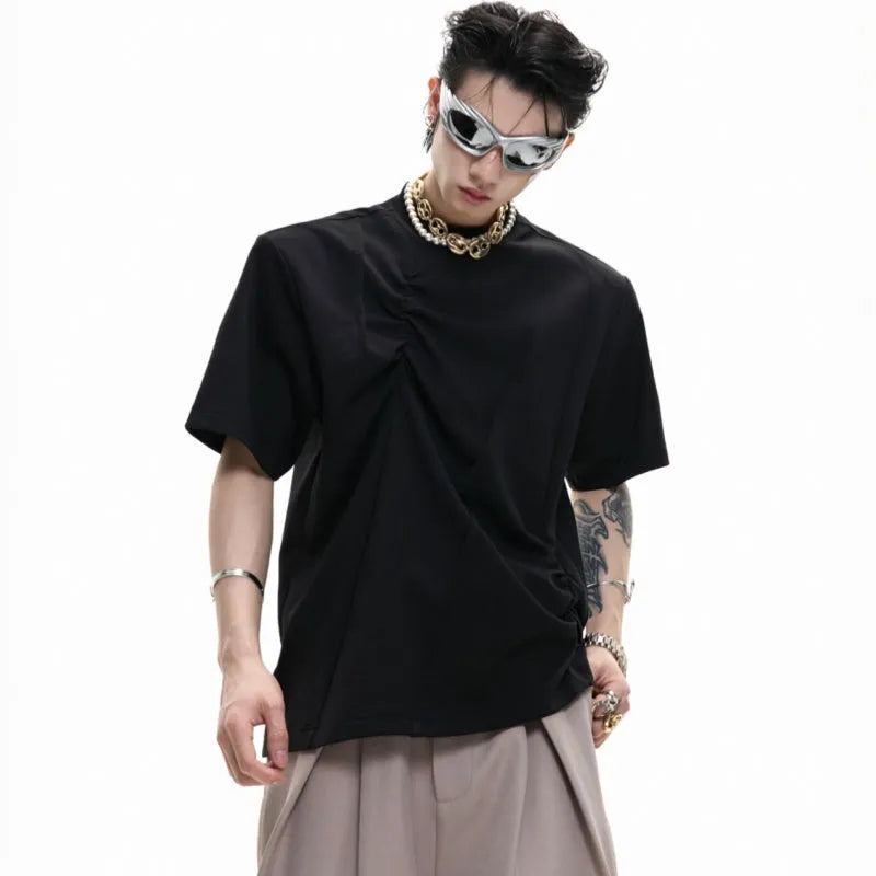 Men's loose grey cotton T-shirt with three-dimensional pleating detail on the front.