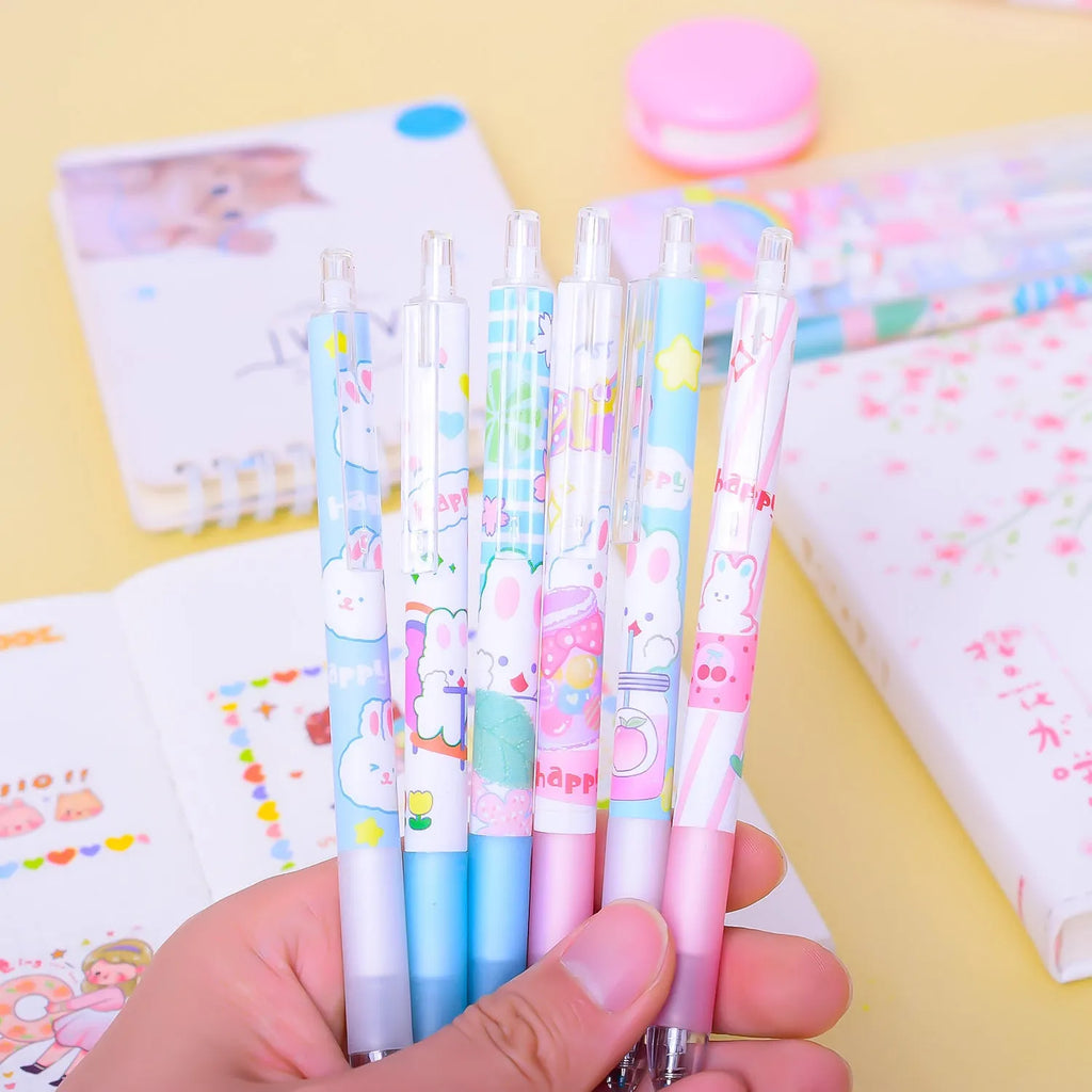 Six Cartoon Bunny brand black plastic pens with 0.5mm tips laid out from their box.