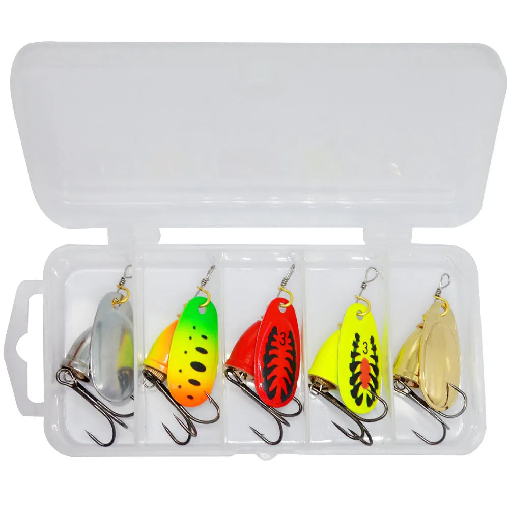 Rotating composite sequin copper bell metal fishing lure in seven colour variations on tackle background