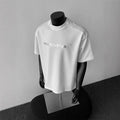 Men's white cotton t-shirt with black printed letters design, loose fit short sleeve pullover style