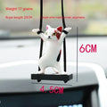 Cartoon-style resin cat pendant on a rope hanger for car interior decoration.