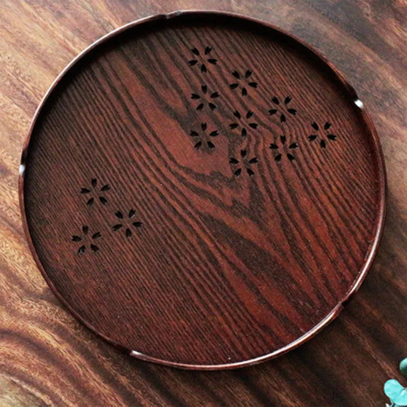 Wooden round plate with hollow cherry blossom pattern, 30 cm diameter.