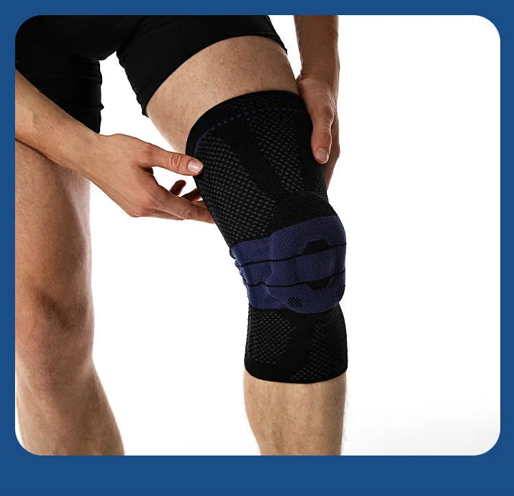 Black and blue adult sports knee pad made from nylon and spandex, shown on a knee.