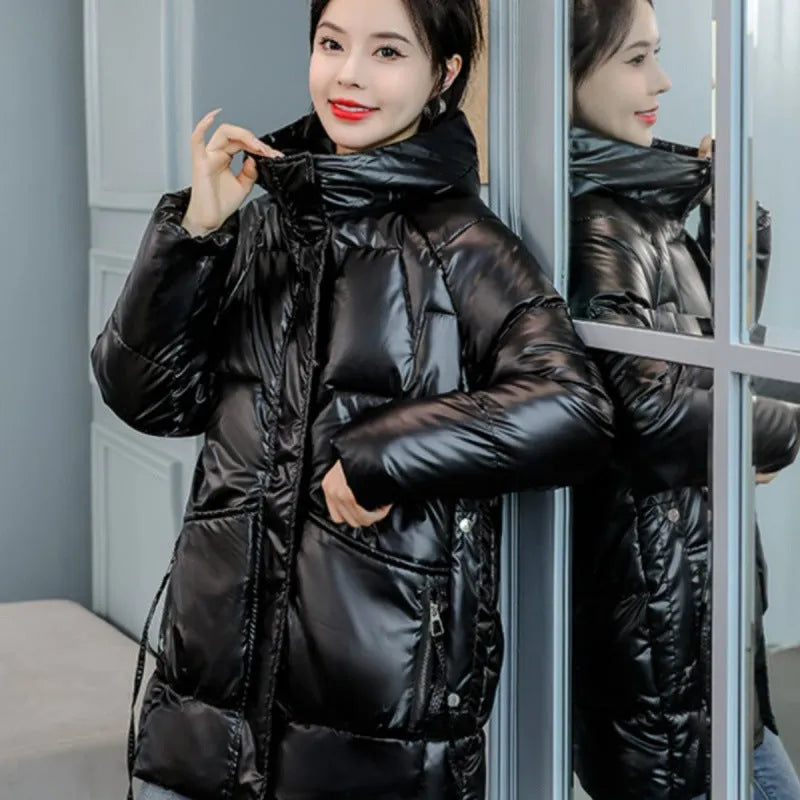 Women's loose thick hooded winter jacket in green, shown with long sleeves and a front zip.