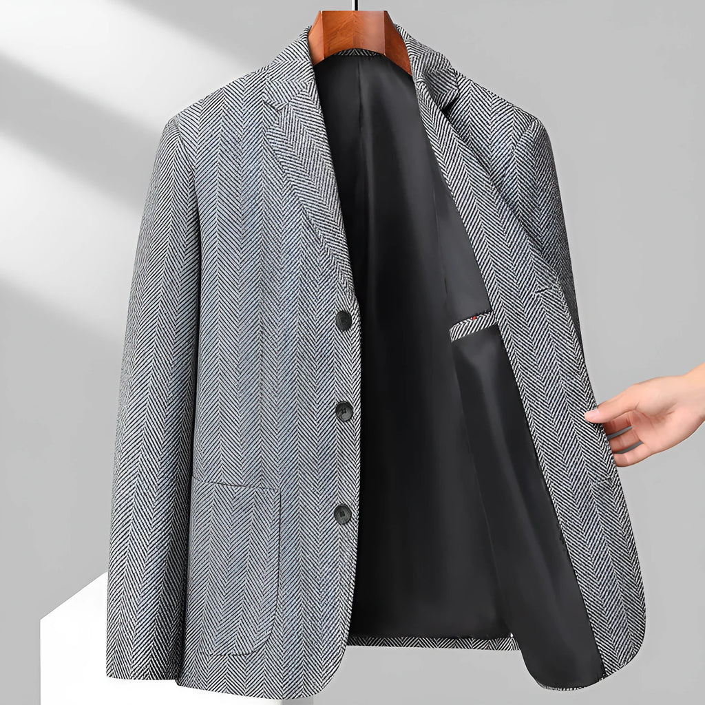 Man wearing a loose fit black woolen coat for casual spring or autumn leisure wear.