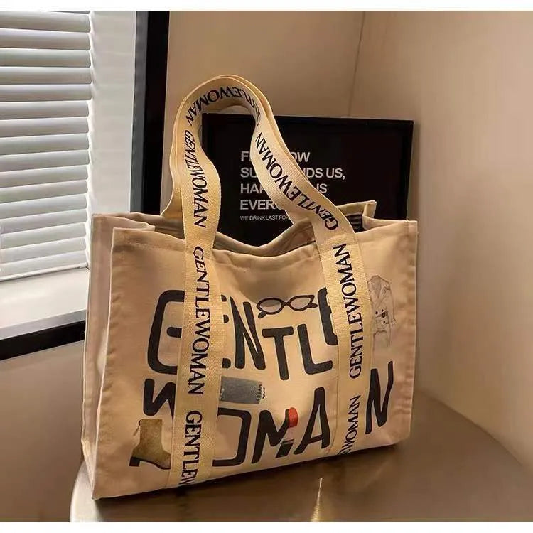 Large canvas tote bag with printed design, shown in available colour and pattern options.