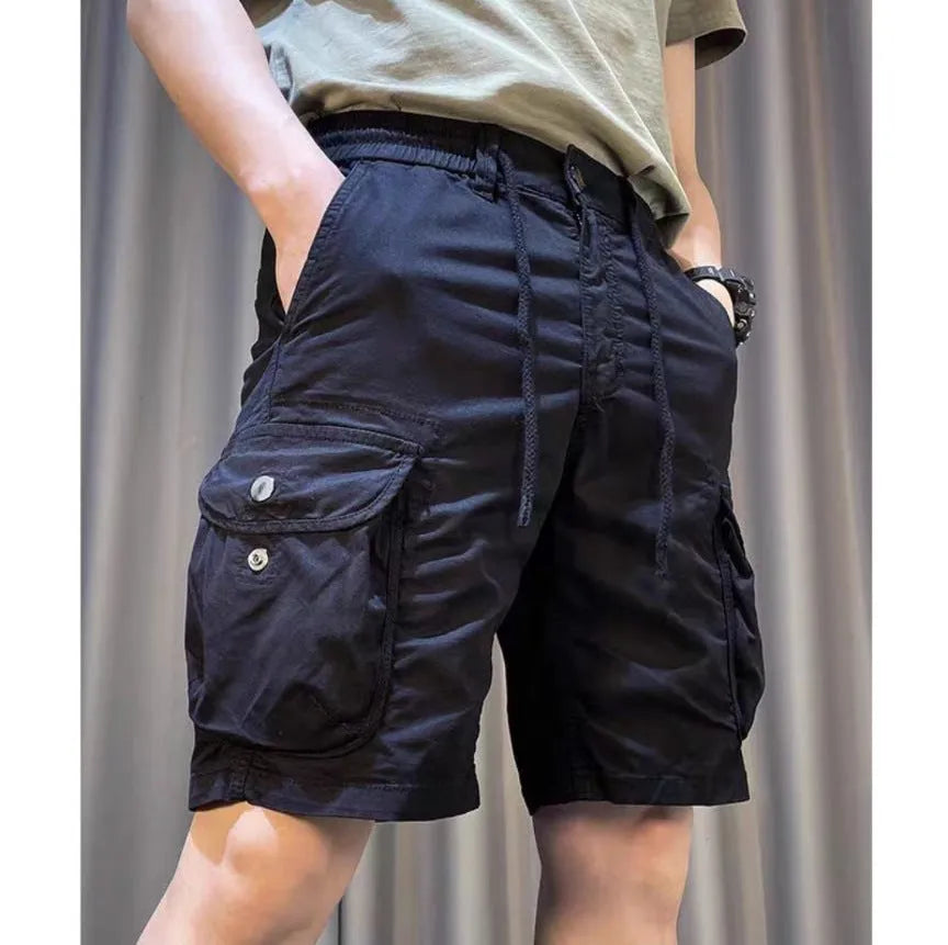 A pair of loose-fitting, straight-leg casual overalls in a khaki colour with multiple visible pockets.