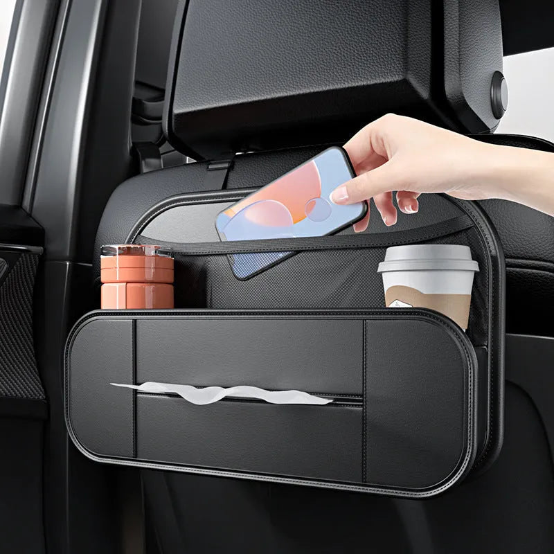 Black leather car seat rear storage bag measuring 36x24x8cm hanging on a vehicle seat back