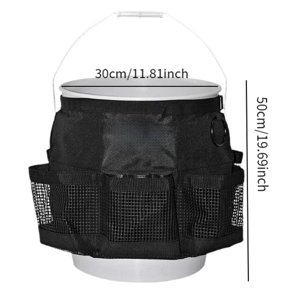 Black cylindrical polyester storage bag hanging on a 5-gallon water barrel for organising tools and gear.