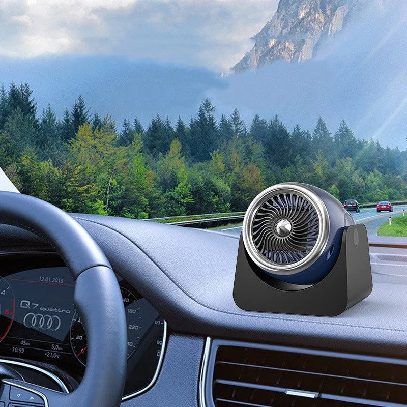 Navy blue 12V car heating fan with adjustable nozzle for defrosting windows and warming car interiors.