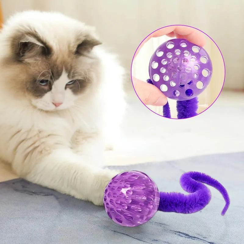 Interactive worm-shaped bouncy ball cat toy with tail in green, pink, or purple colours