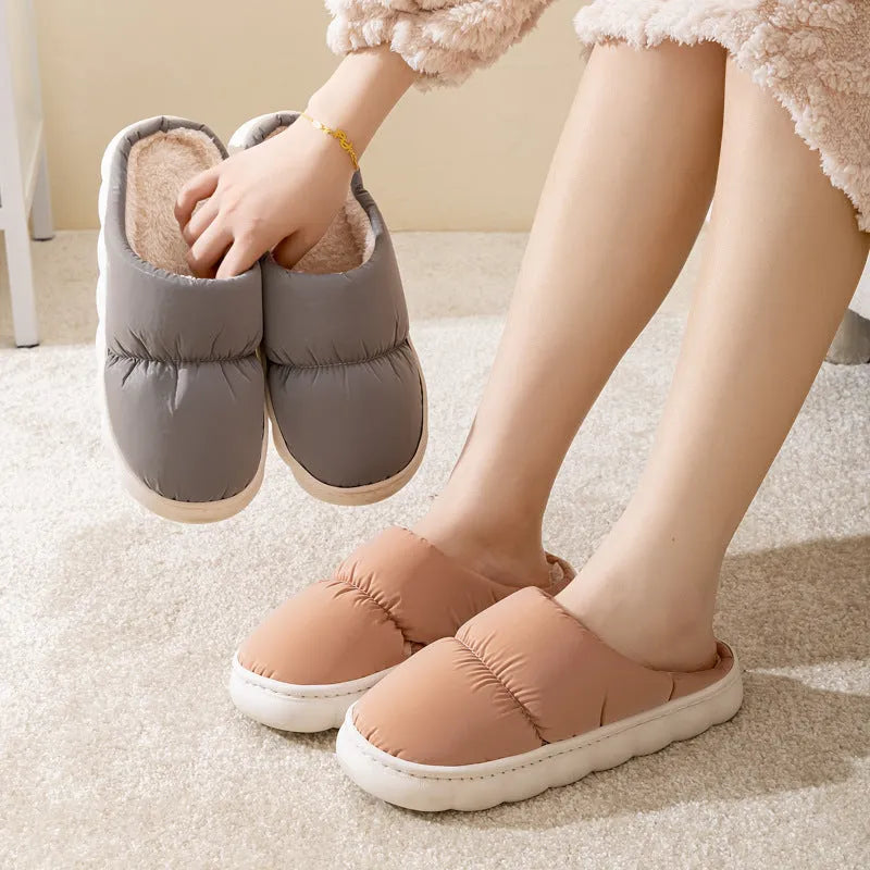 Blue couple's winter slippers with artificial leather upper, plush lining, and thick rubber anti-slip sole.