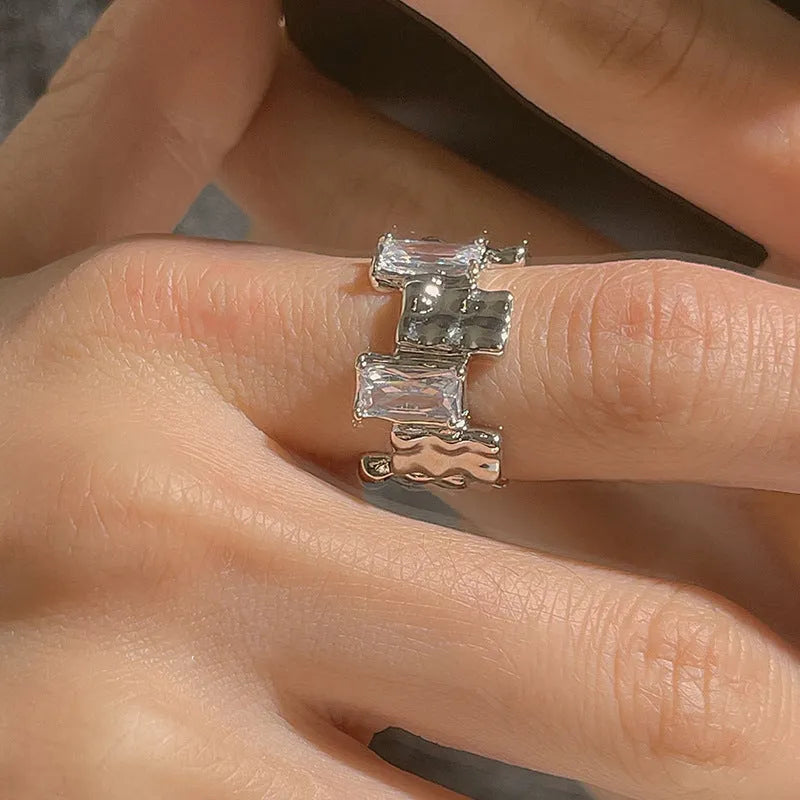 Geometric open silver ring with cross zircon gemstones and three-dimensional decoration