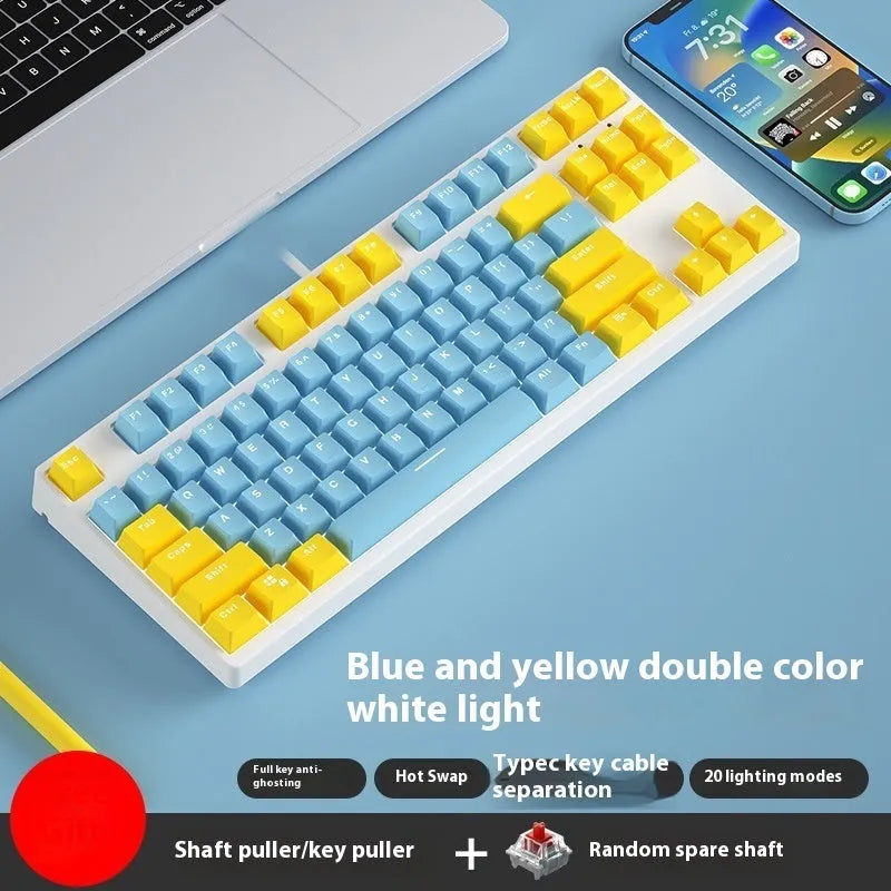 87 key wired mechanical keyboard with metal chassis shown in a black, orange, and yellow colour configuration.