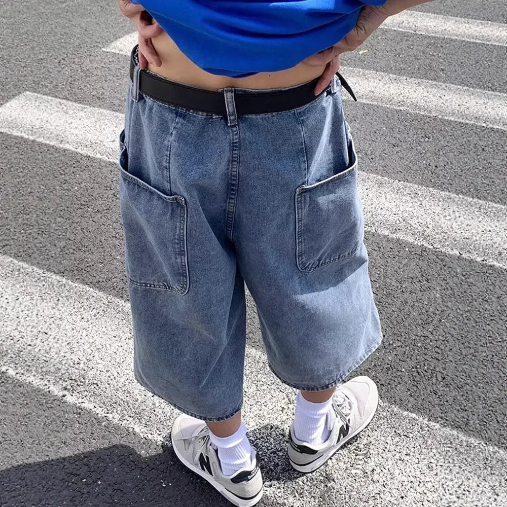 Men's blue high-waisted denim pirate shorts with a cropped, straight leg and zipper fly.
