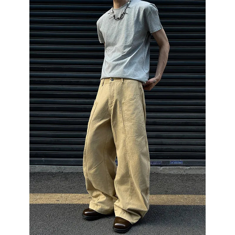 Men's khaki-coloured straight-leg cotton trousers laid flat, showing American retro casual style.