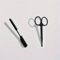 Black pet grooming brush with dual heads: soft bristles for eye cleaning and comb for hair removal