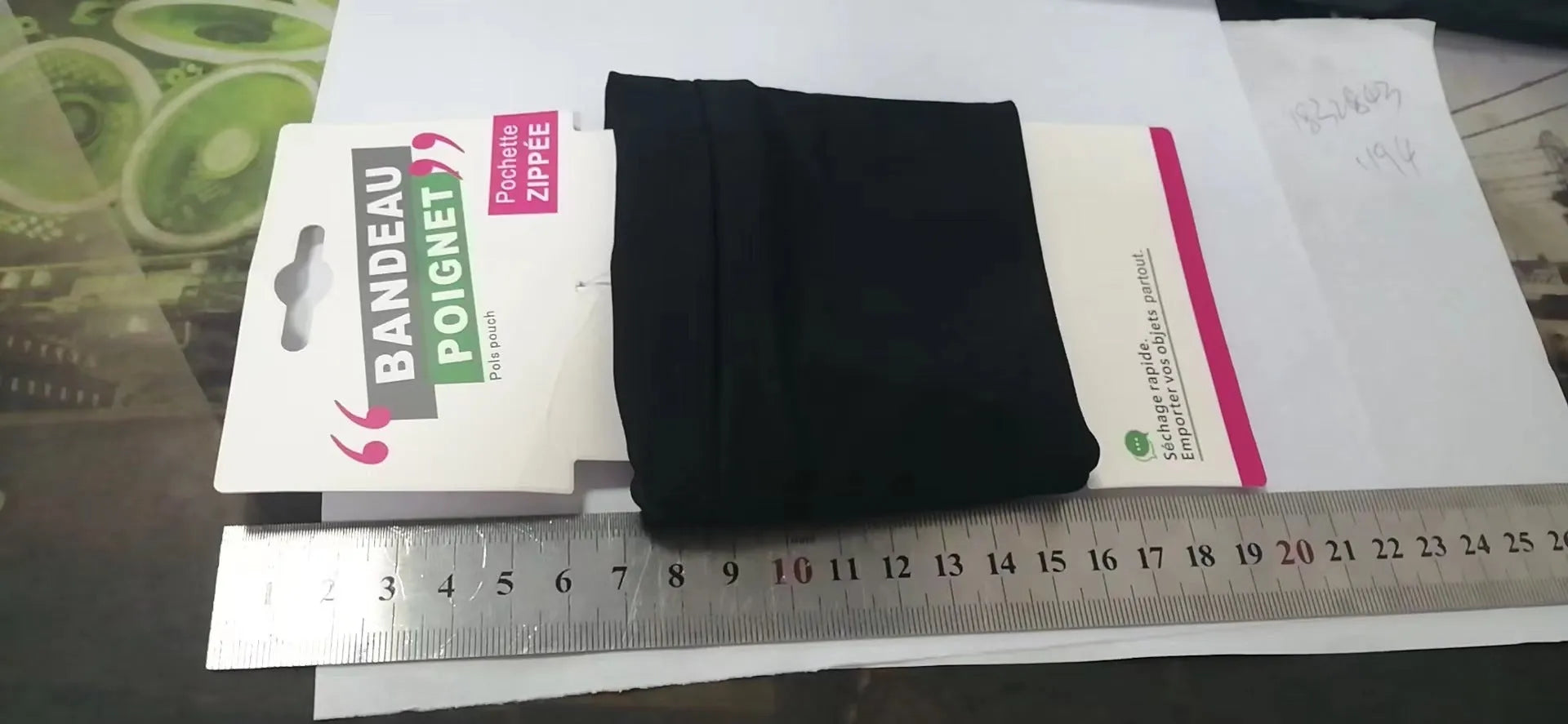 Compact 10x10.5cm wrist bag armband sleeve for mobile phones, shown with cardboard packaging for camping and fitness use.
