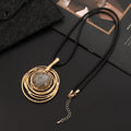 Gold geometric plaid pendant necklace with a textured snakeskin wax rope chain.