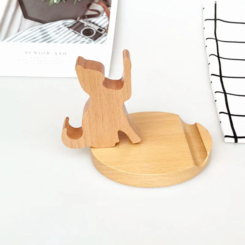 Beech wood mobile phone holder with resin animal decoration and custom lettering on coin back.