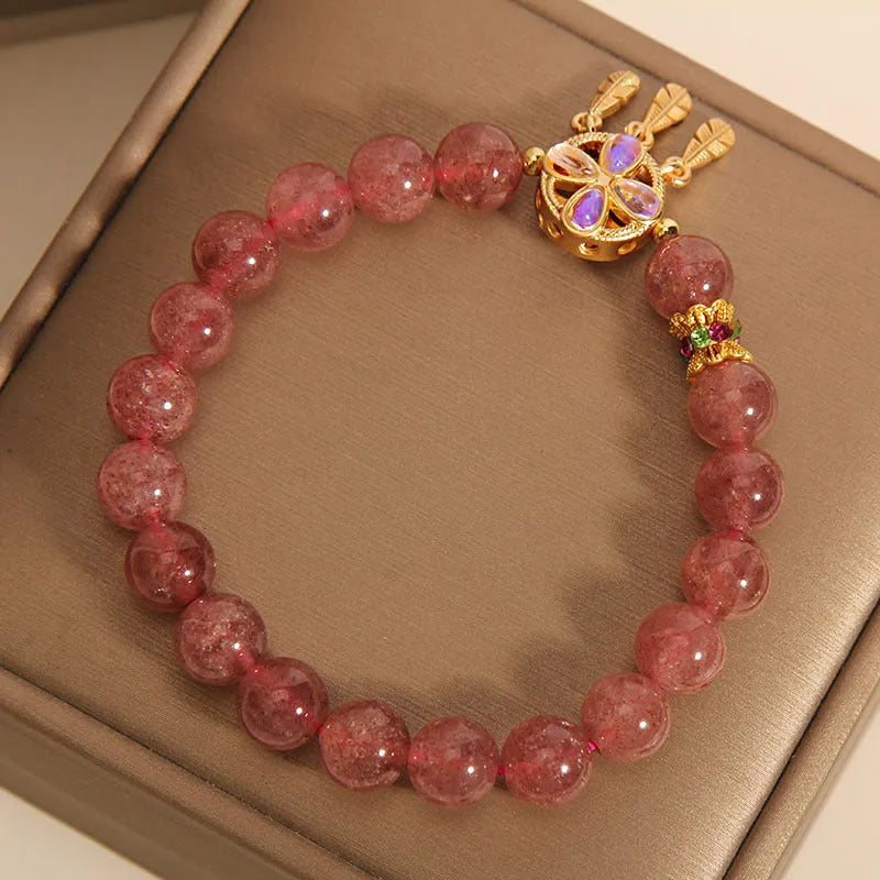 Women's strawberry quartz crystal bracelet with four leaf dream catcher ball pendant