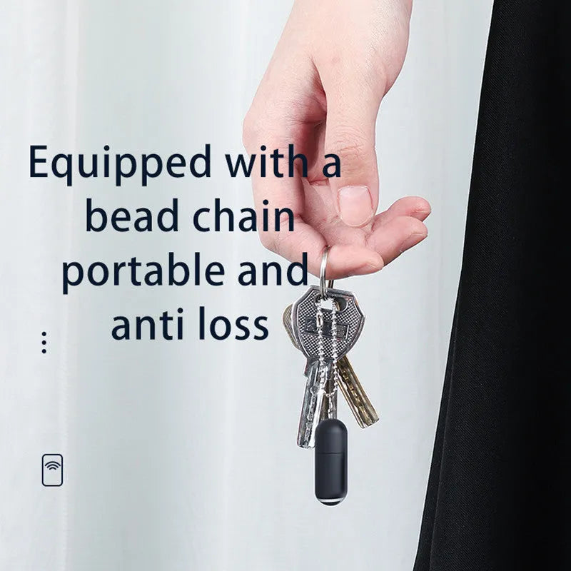 Black capsule infrared remote emitter with Lightning, USB-C, and micro-USB plug options on a white background.