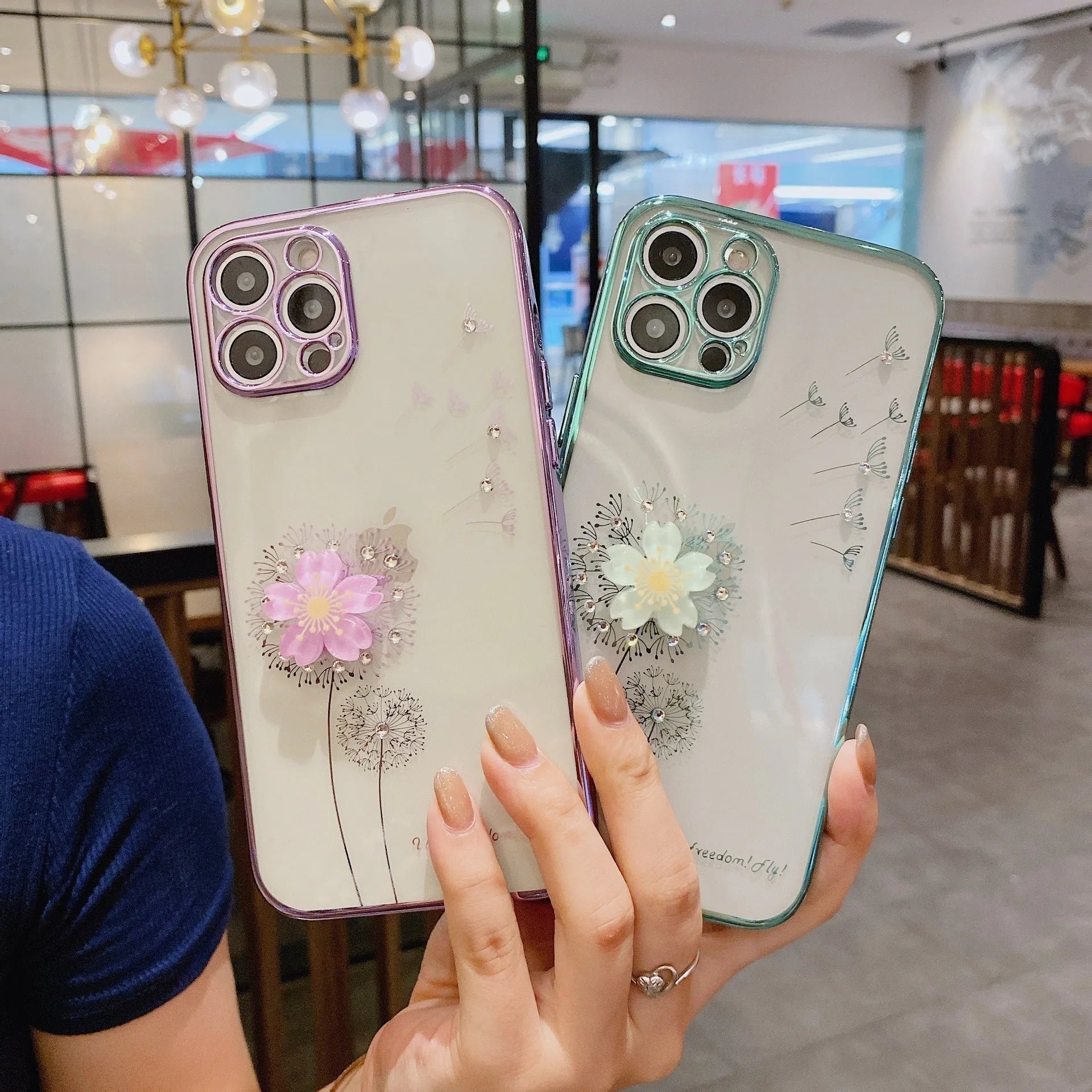 Green iPhone case with a 3D floral spin stand on the back and a built-in screen protector.