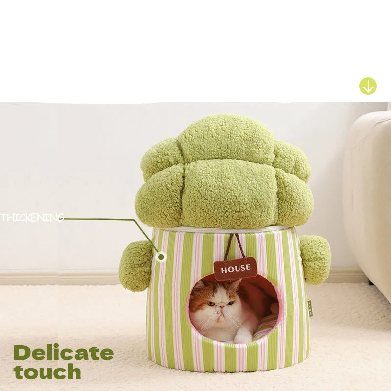 Green cauliflower-shaped enclosed cotton pet house for small dogs or cats on a wooden floor.