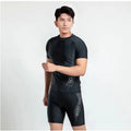 Men's patterned polyester swimsuit set with top and trousers on a mannequin