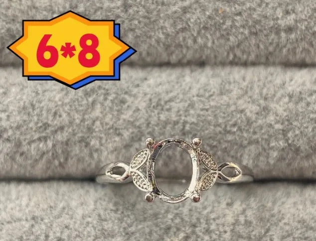 Oval denier ring with open mouth design, 6x8 main stone, and five-pointed star motif in electroplated copper
