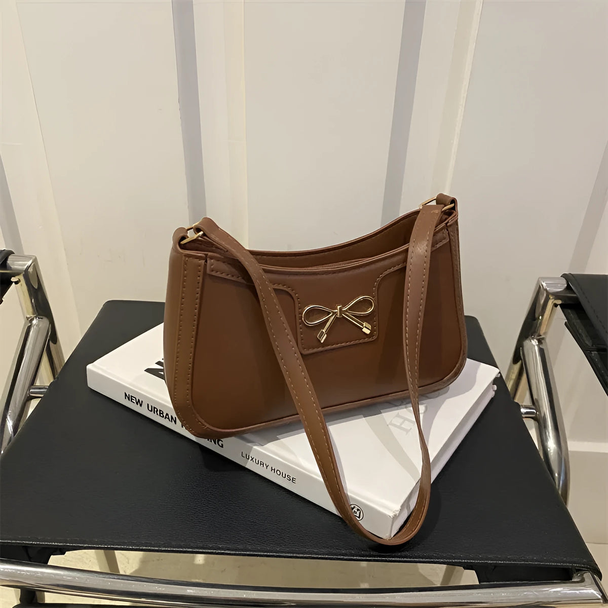 Western style baguette shoulder bag in horizontal square shape with bow decoration, shown in available colours