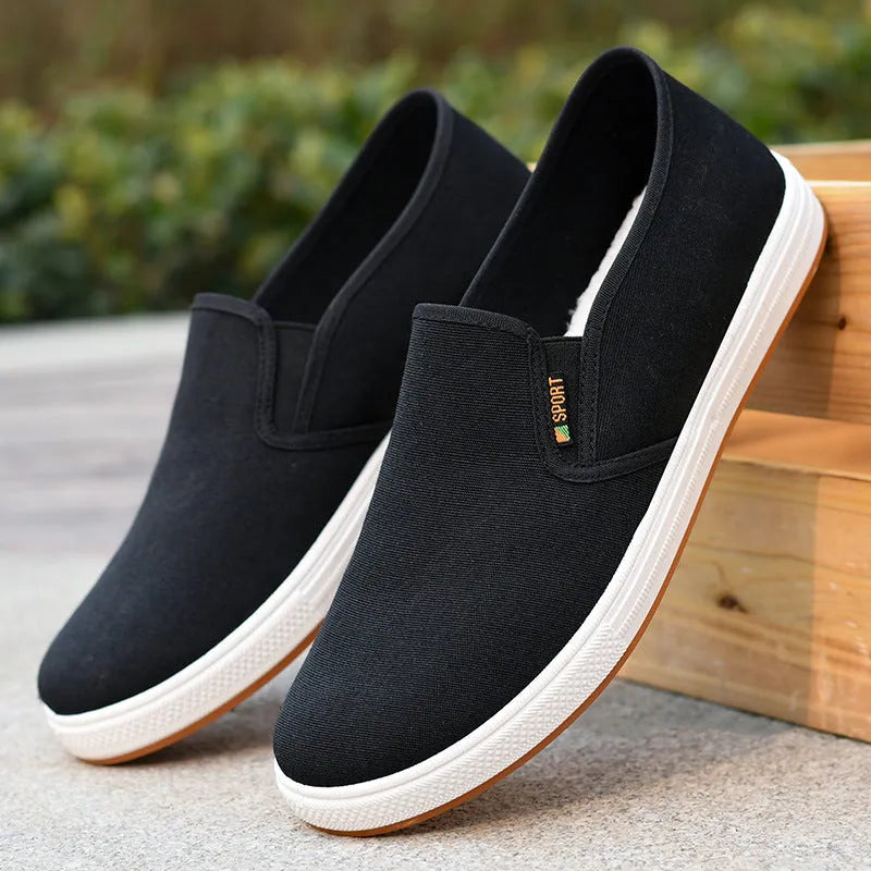 Men's black slip-on canvas cloth shoes with round toe and injection moulded sole