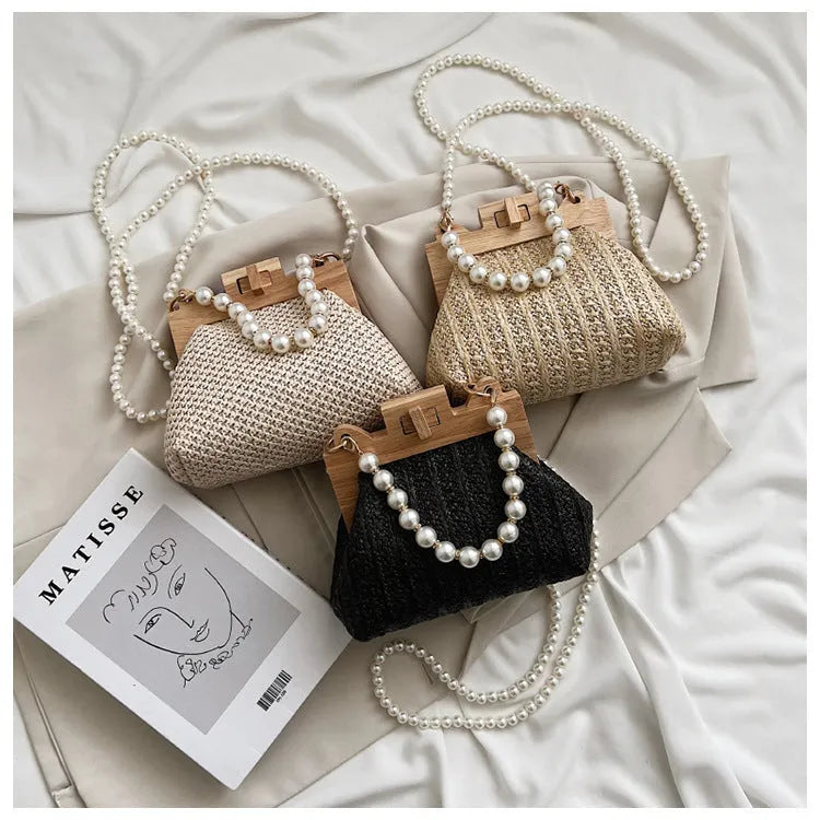 Women's straw shoulder bag with pearl chain detail in horizontal square shape