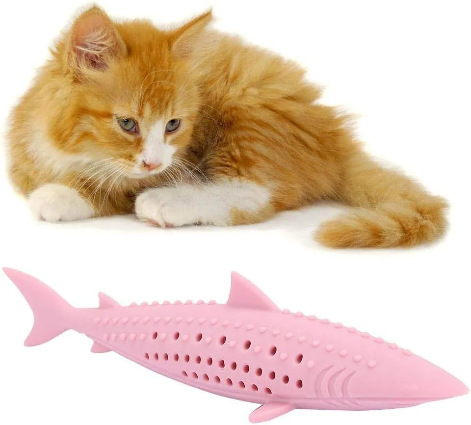 Green silicone fish-shaped cat chew toy with dental cleaning texture and side holes