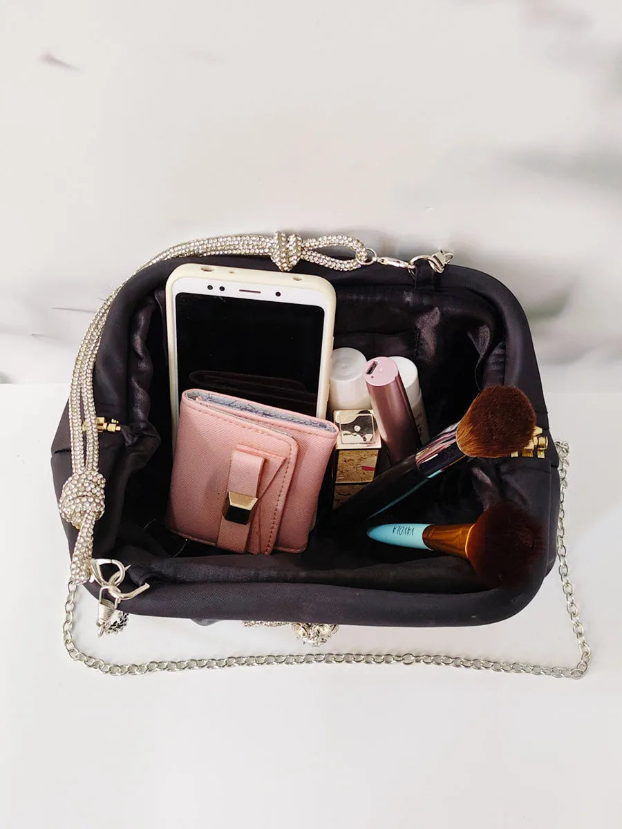 Women's soft polyester dinner bag with chain detailing, document compartment, and shell-shaped design in three colour options