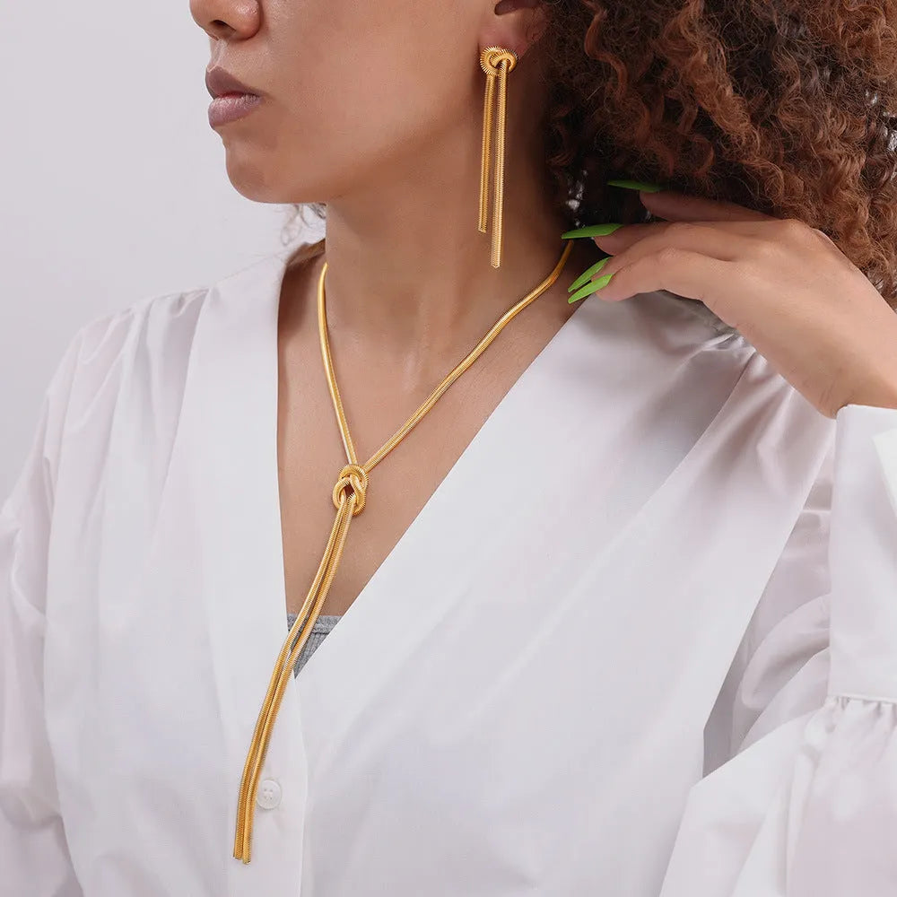 Gold knotted tassel pendant on snake chain necklace with matching earrings set