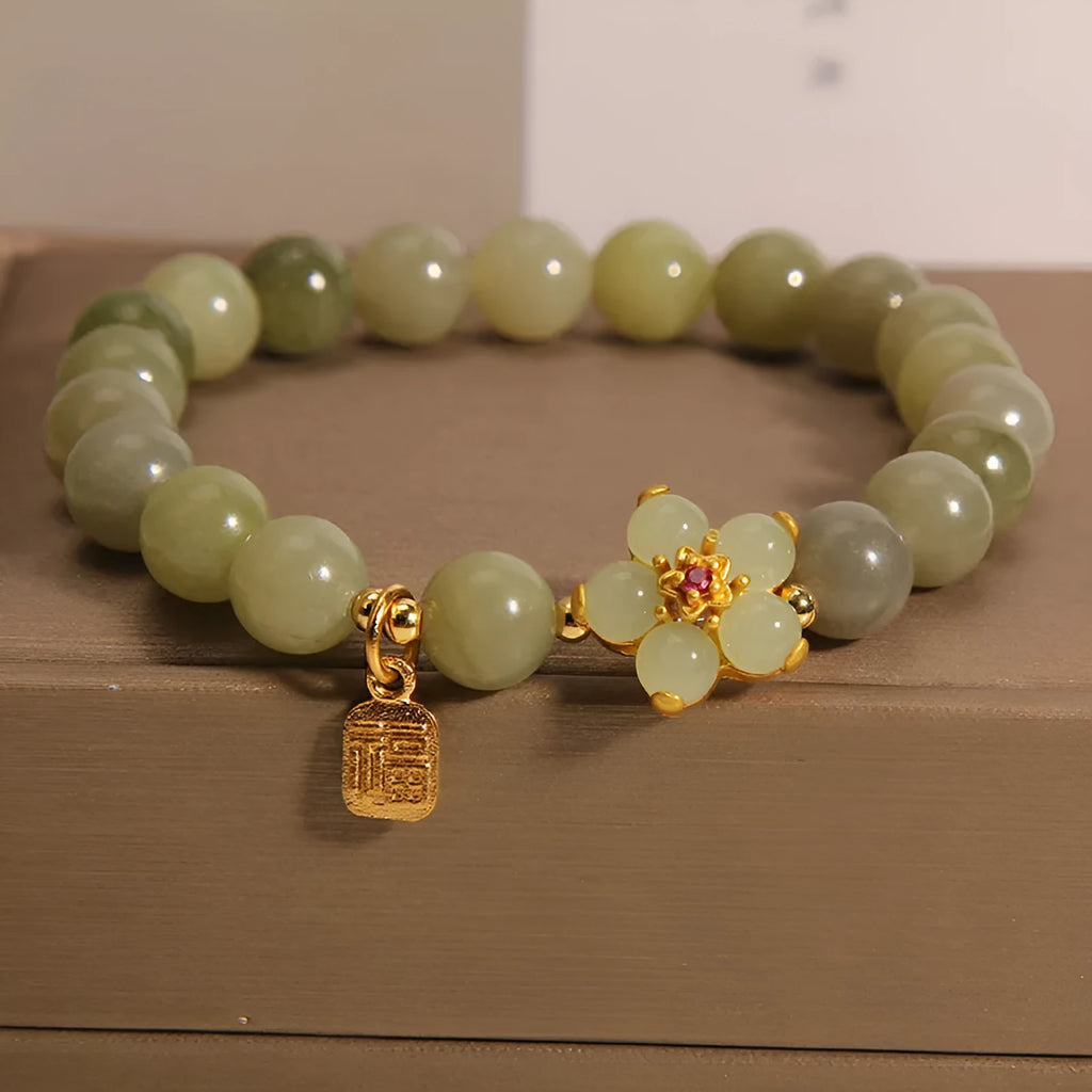 A grey jade coloured alloy bracelet with a casual style for women.